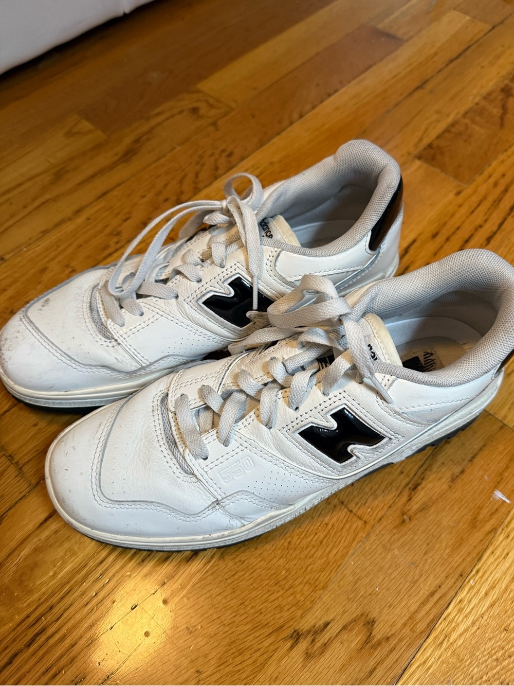 New Balance White Leather Sneakers with Black 'N' Logo
